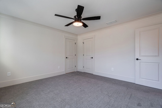 carpeted empty room with ceiling fan