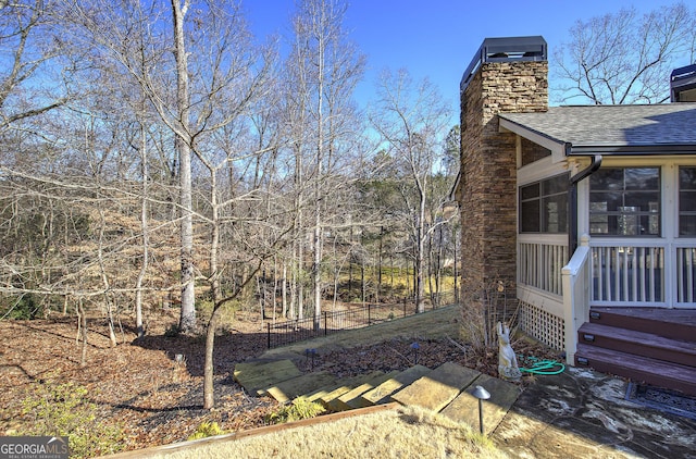 view of yard featuring a sunroom