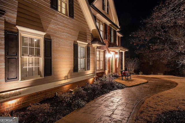 view of property exterior at night