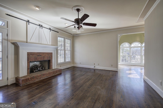 unfurnished living room featuring ornamental molding, a fireplace, and dark hardwood / wood-style flooring