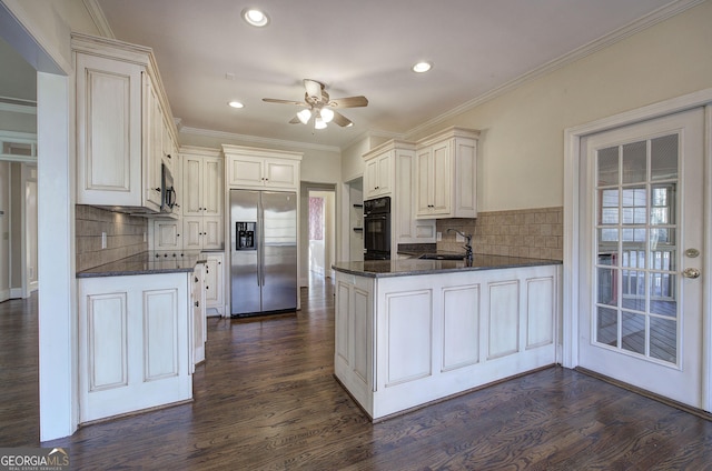 kitchen featuring sink, dark hardwood / wood-style floors, built in fridge, and kitchen peninsula