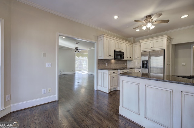 kitchen featuring stainless steel fridge with ice dispenser, dark wood-type flooring, ornamental molding, and dark stone counters