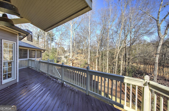 wooden terrace featuring a sunroom