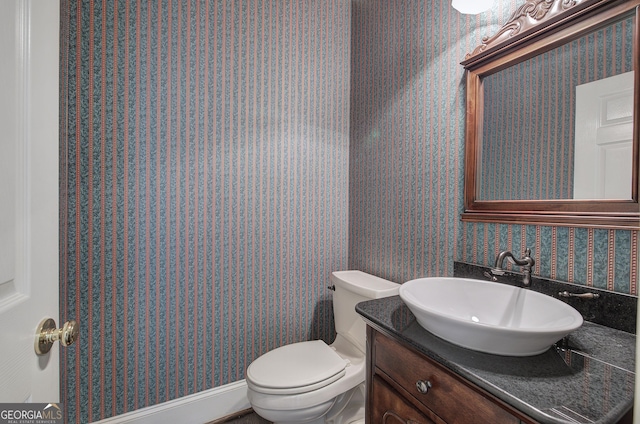 bathroom with vanity and toilet