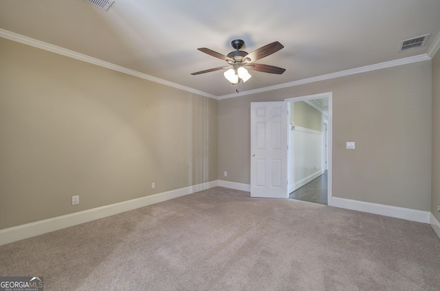 carpeted spare room with ornamental molding and ceiling fan