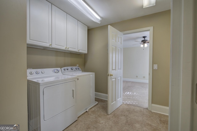 washroom featuring washing machine and dryer, cabinets, ceiling fan, and light tile patterned flooring