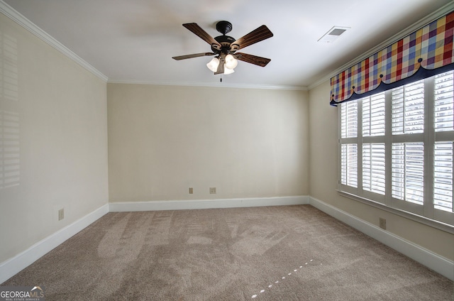 empty room with ornamental molding, light carpet, and ceiling fan