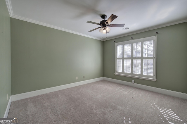 spare room featuring light carpet, ornamental molding, and ceiling fan