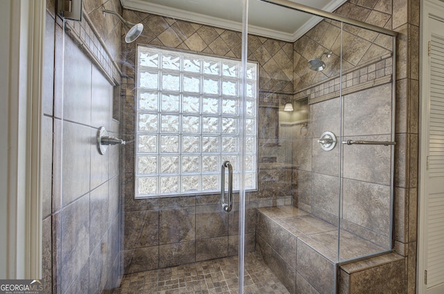 bathroom with crown molding and a shower with door