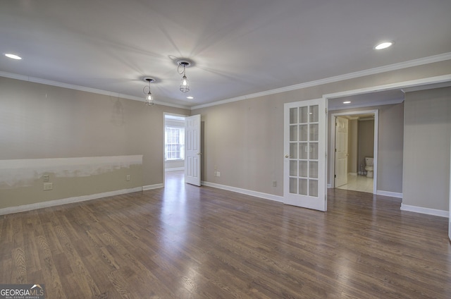 unfurnished room featuring ornamental molding and dark hardwood / wood-style flooring