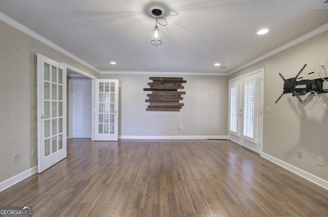 spare room with french doors, crown molding, and dark wood-type flooring