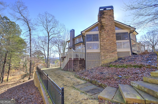 view of home's exterior featuring a sunroom