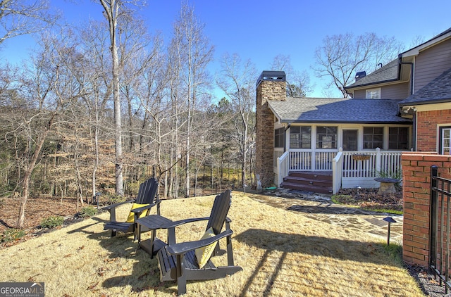 view of yard featuring a sunroom