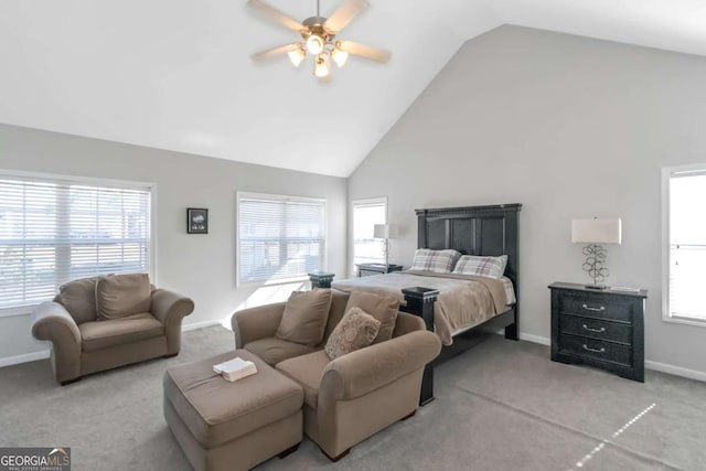 carpeted bedroom with high vaulted ceiling and ceiling fan