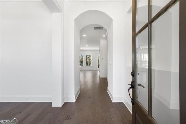 hall with dark hardwood / wood-style flooring