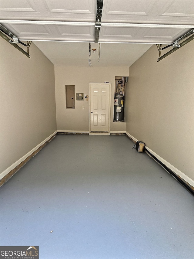 garage featuring electric panel and electric water heater