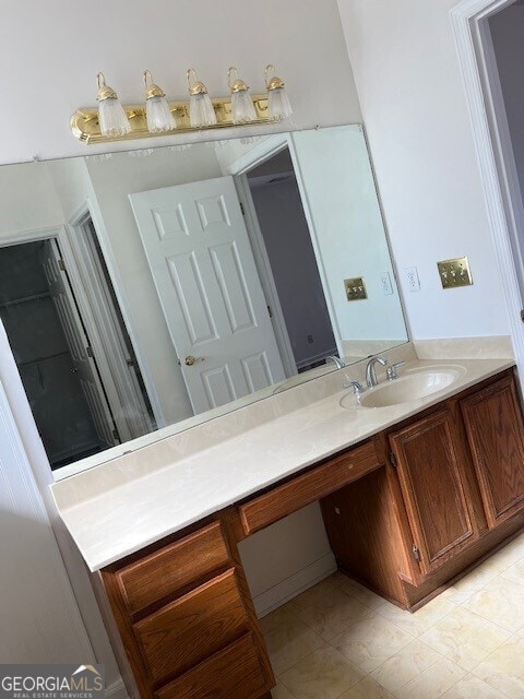 bathroom with tile patterned floors and vanity