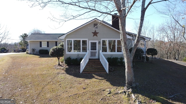 view of front of house with a front lawn