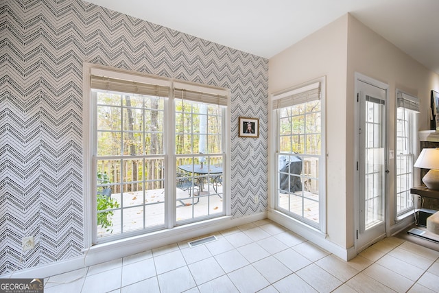 entryway featuring light tile patterned flooring