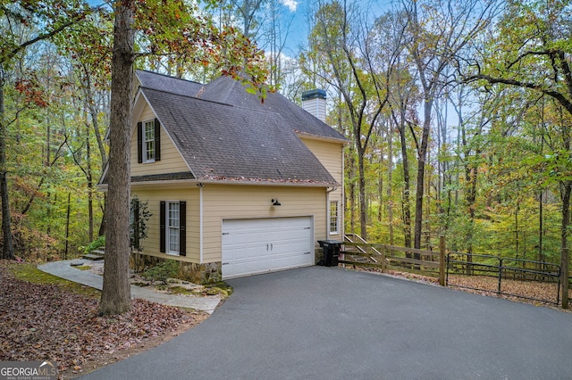 view of side of property featuring a garage