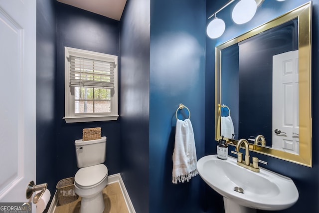 bathroom with sink and toilet