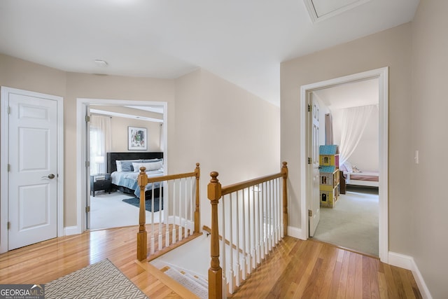 hallway with light hardwood / wood-style flooring