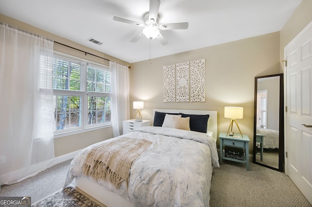 carpeted bedroom with ceiling fan