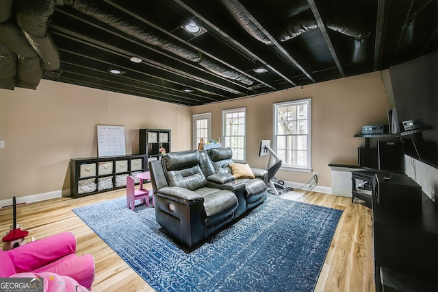 home theater featuring hardwood / wood-style floors