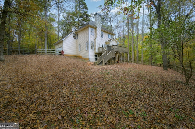 view of home's exterior featuring a wooden deck