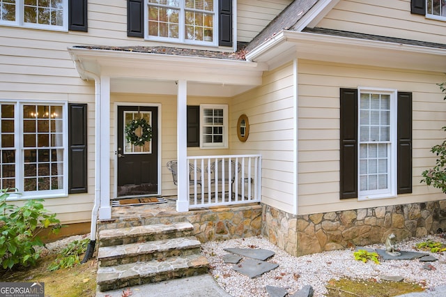 entrance to property featuring a porch