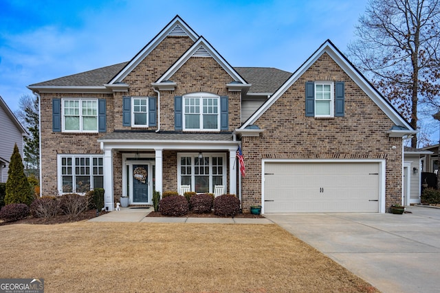 craftsman-style house featuring a garage and a front yard