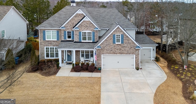 view of front of property with a porch and a garage