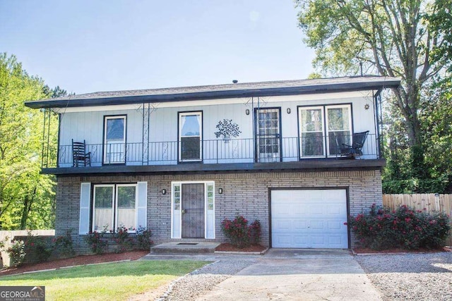 view of front of house with a garage and a balcony