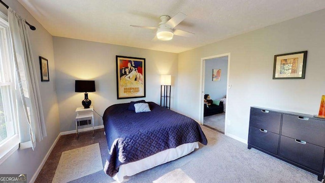 bedroom with ceiling fan and carpet flooring