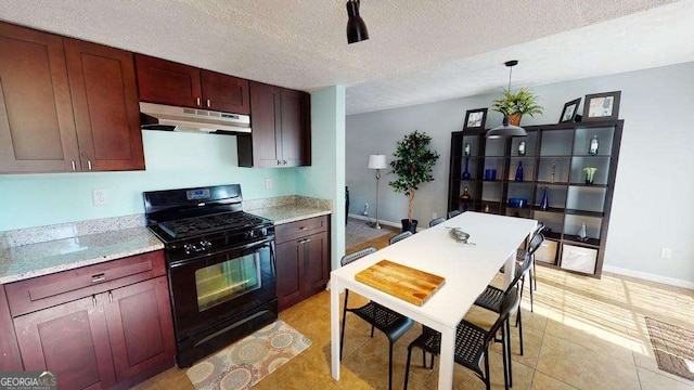 kitchen featuring decorative light fixtures, a textured ceiling, light tile patterned floors, light stone countertops, and black gas range