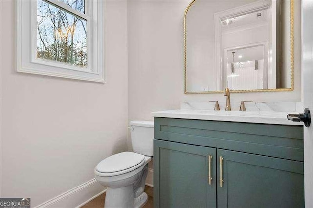 bathroom featuring vanity and toilet