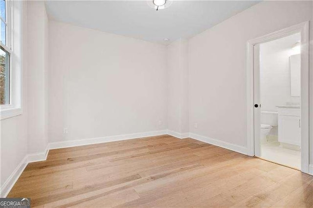 spare room featuring light hardwood / wood-style floors