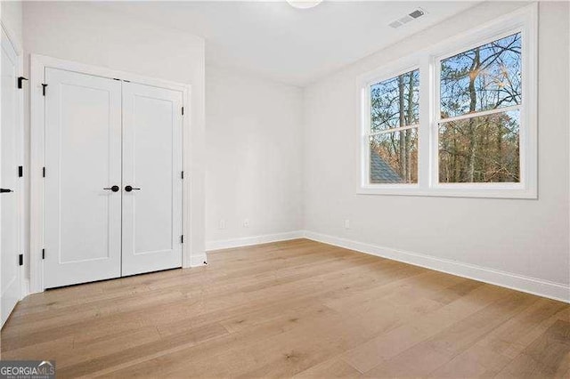 unfurnished bedroom featuring light hardwood / wood-style flooring