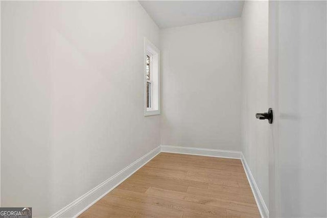 unfurnished room with light wood-type flooring