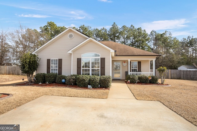 single story home featuring covered porch