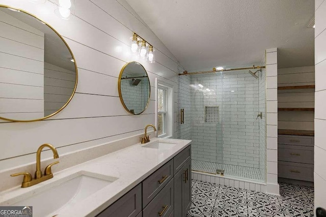 bathroom featuring tile patterned floors, vanity, and an enclosed shower