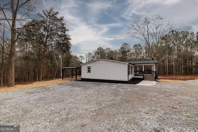 view of property exterior with covered porch