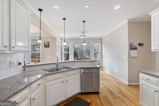 kitchen with white cabinetry, sink, and stainless steel dishwasher