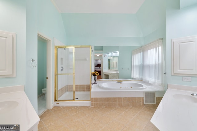 full bathroom featuring lofted ceiling, toilet, tile patterned flooring, and vanity