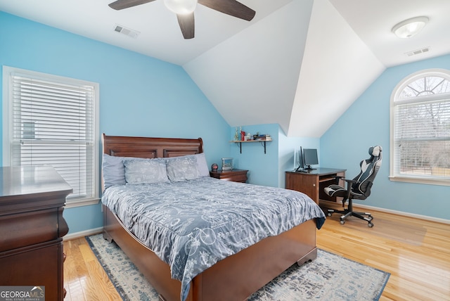 bedroom with lofted ceiling, hardwood / wood-style floors, and ceiling fan