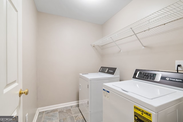 laundry room featuring washing machine and dryer