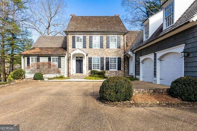 colonial home with a garage