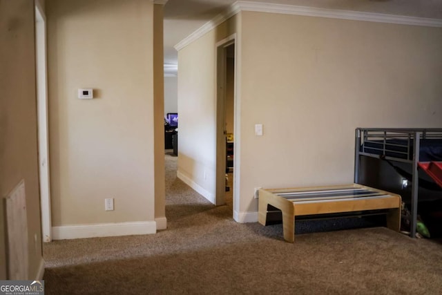 bedroom with ornamental molding and carpet flooring