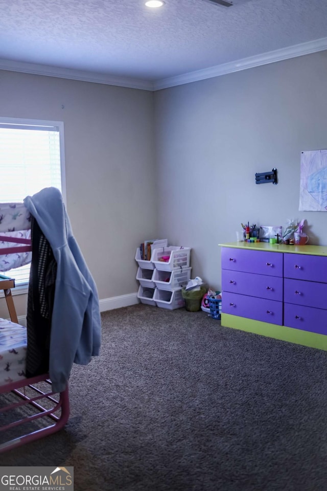 rec room featuring ornamental molding, carpet, and a textured ceiling