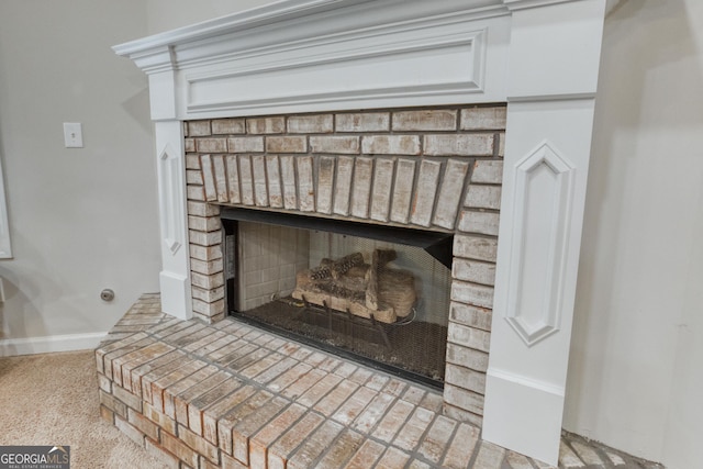 details featuring carpet flooring and a brick fireplace